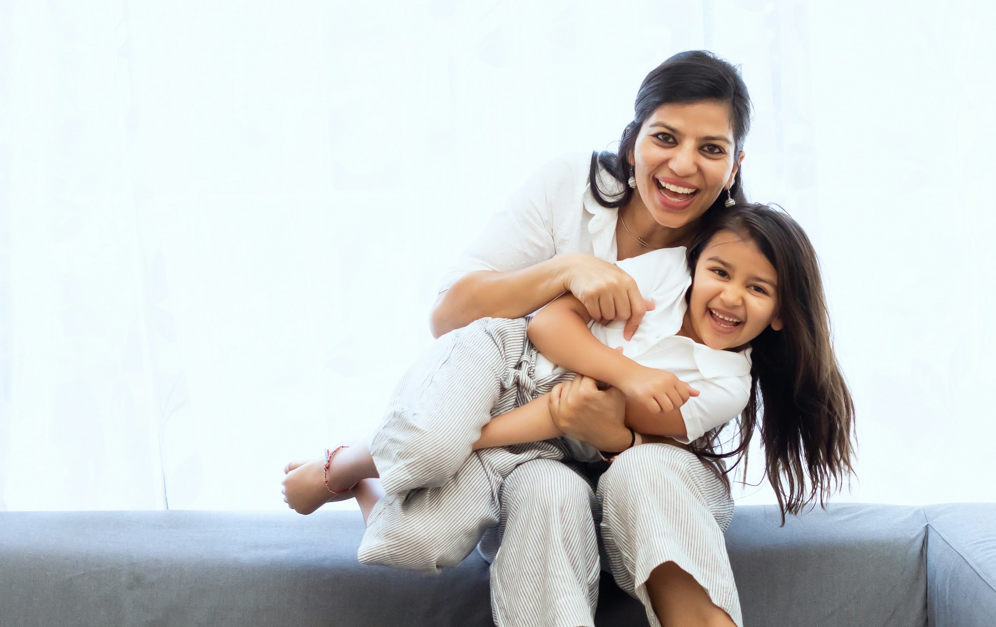 Happy mother and daughter smiling after a dental visit at Kennedy Square Dental in Brampton, Ontario